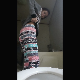 An attractive girl bends over in front of a toilet, takes a hard, wide, chunky shit and a piss. Presented in 720P vertical HD format. About a minute.
